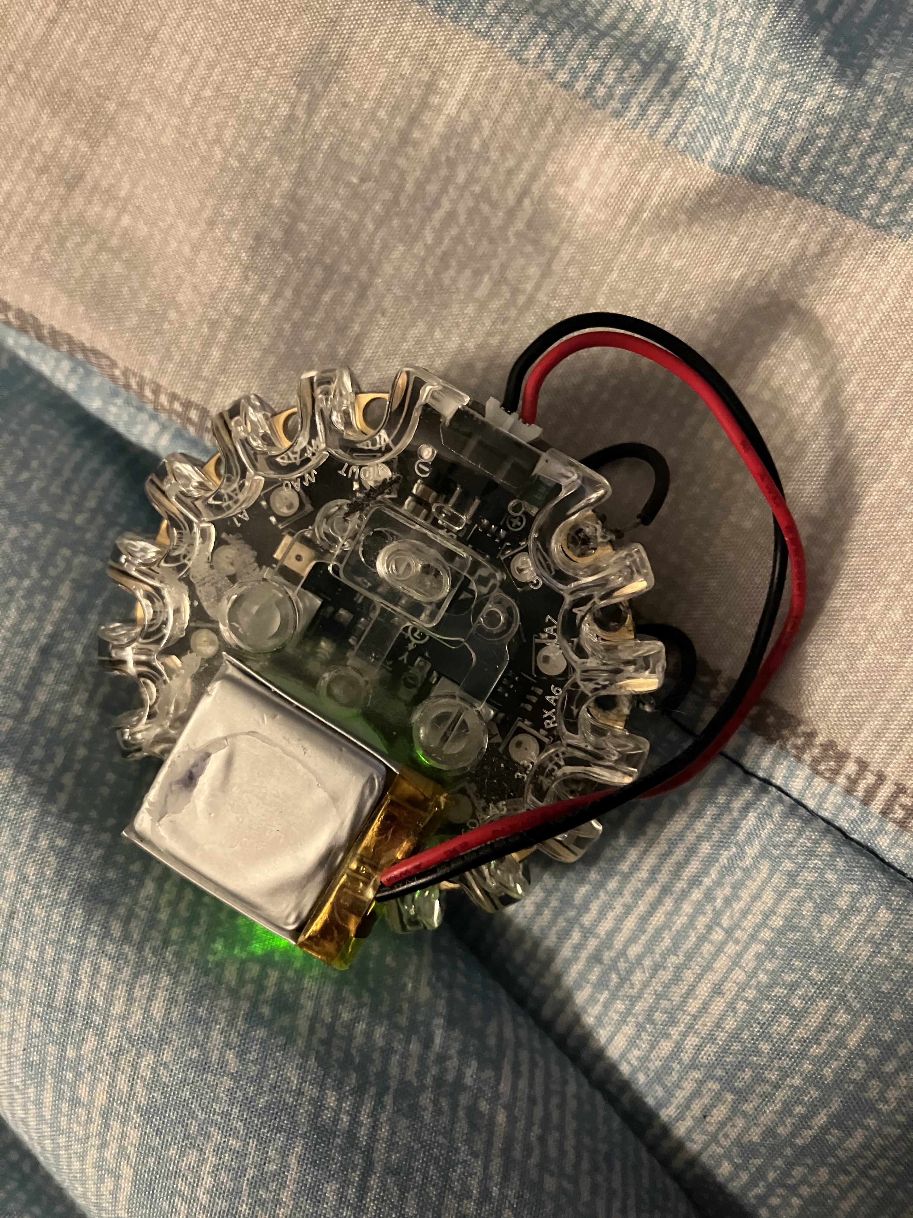 Rear of the beacon prototype showing the attached battery and wiring